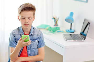Image showing boy with smartphone being bullied by text message