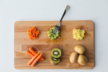 Image showing mashed fruits and vegetables with forks on board