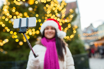 Image showing woman taking selfie with smartphone at christmas 