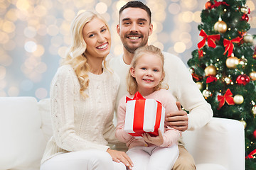 Image showing happy family with christmas gift