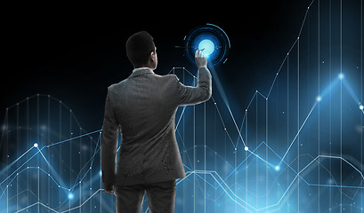 Image showing businessman working with virtual chart projection