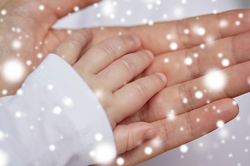 Image showing close up of mother and newborn baby hands