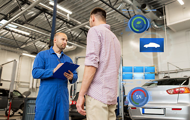 Image showing auto mechanic with clipboard and man at car shop