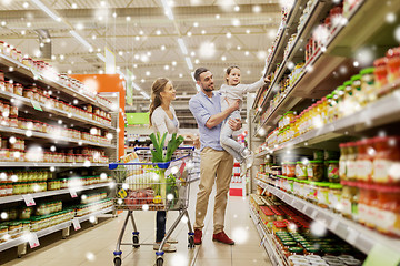 Image showing family with food in shopping cart at grocery store