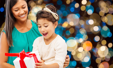Image showing happy mother and daughter girl with gift box