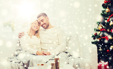 Image showing happy couple at home with christmas tree