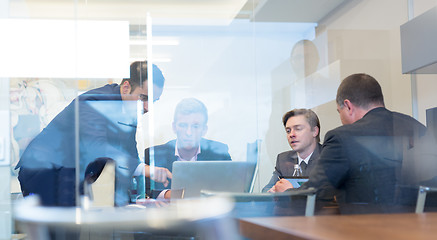 Image showing Business people sitting and brainstorming at corporate meeting.