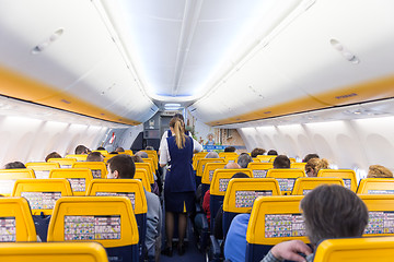 Image showing Stewardess serving passangers on Ryanair airplane flight on 14th of December, 2017 on a flight from Trieste to Valencia.