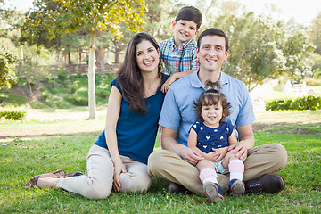 Image showing Attractive Young Mixed Race Family Portrait in the Park.