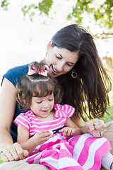 Image showing Mixed Race Young Mother and Cute Baby Girl Applying Fingernail P