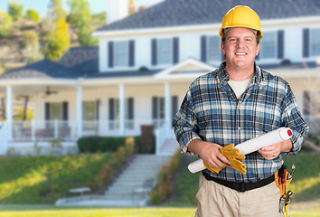 Image showing Contractor With Plans and Hard Hat In Front of Beautiful Custom 