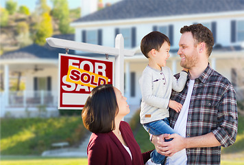 Image showing Young Mixed Race Caucasian and Chinese Family In Front of Sold F