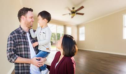 Image showing Young Mixed Race Caucasian and Chinese Family Inside Empty Room 