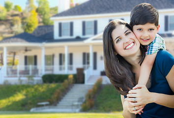 Image showing Young Mother and Son In Front Yard of Beautiful Custom House.