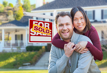 Image showing Mixed Race Caucasian and Chinese Couple In Front of Sold For Sal