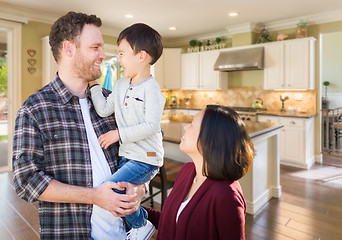 Image showing Young Mixed Race Caucasian and Chinese Family Inside Custom Kitc