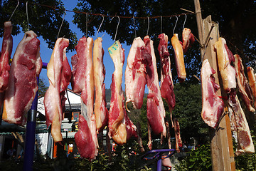 Image showing The meat drying outside on the sun