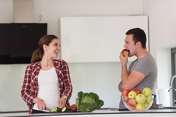 Image showing Young handsome couple in the kitchen