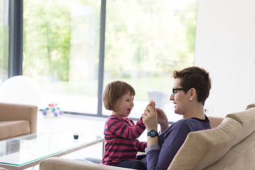 Image showing mother and cute little girl enjoying their free time