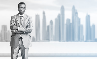 Image showing Young black businessman in front of the big city