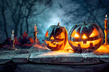 Image showing Halloween pumpkins on blue background