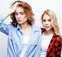 Image showing best friends teenage girls together having fun, posing emotional on white background, besties happy smiling, lifestyle people concept close up