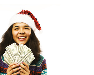 Image showing cute young girl in santas red hat with money isolated