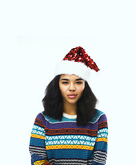 Image showing cute young girl in santas red hat isolated