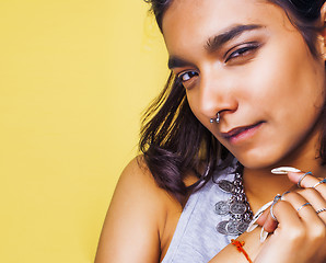 Image showing lifestyle people concept. young pretty smiling indian girl with long nails wearing lot of jewelry rings, asian summer happy cool 