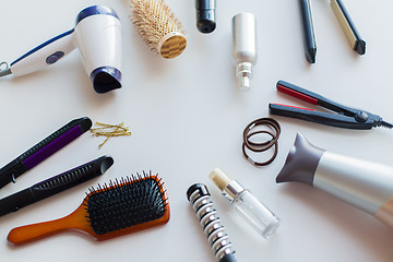 Image showing hairdryers, irons, hot styling sprays and brushes