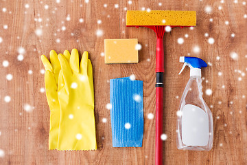 Image showing squeegee with window cleaning stuff on wood