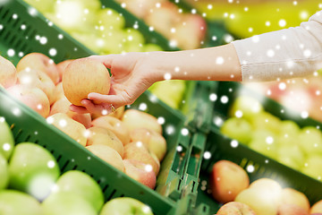 Image showing hand with apples at grocery store