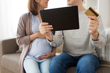 Image showing close up of man and pregnant wife shopping online