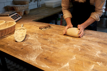 Image showing baker making bread dough at bakery kitchen