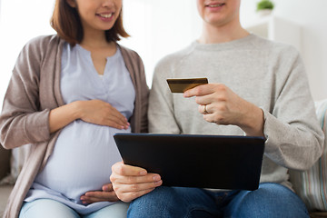 Image showing close up of man and pregnant wife shopping online