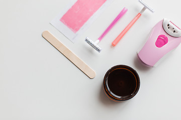 Image showing hair removal wax, epilator and safety razor