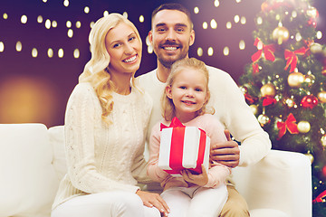 Image showing happy family with christmas gift