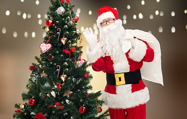 Image showing santa claus with bag and christmas tree