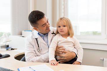 Image showing doctor or pediatrician with girl patient at clinic