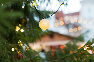 Image showing close up of christmas tree garland bulb outdoors