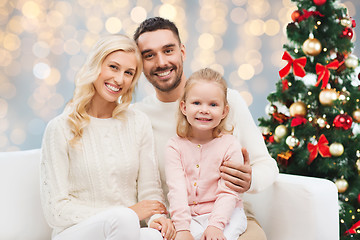 Image showing happy family over christmas tree