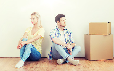 Image showing unhappy couple having argument at home