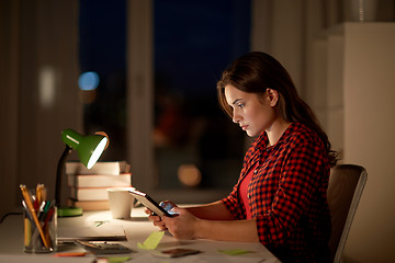 Image showing student girl or woman with tablet pc at night home