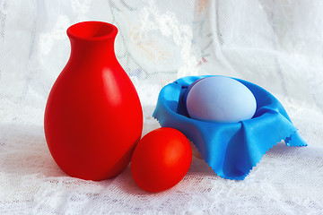 Image showing Colorful Easter Eggs And A Jug On A Lace