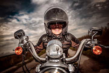 Image showing Biker girl on a motorcycle