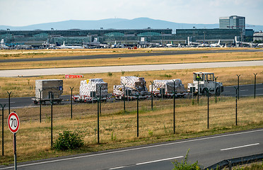 Image showing Luggage airport loading and unloading Luggage for passengers.