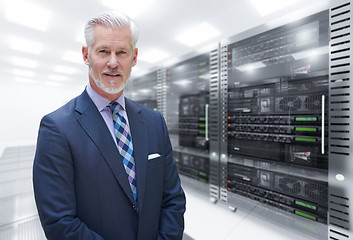 Image showing Senior businessman in server room