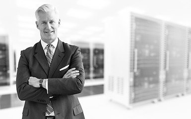 Image showing Senior businessman in server room