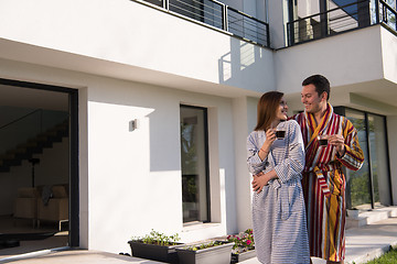 Image showing Young beautiful couple in bathrobes