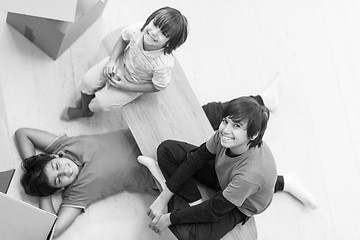 Image showing boys with cardboard boxes around them top view